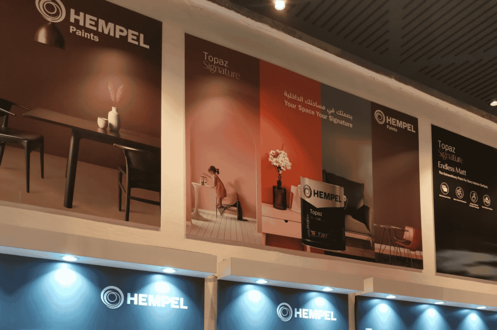 Hempel Paints showroom display featuring Topaz Signature wall advertisements and interior design inspiration under professional lighting.