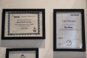 Professional certificates for Bilal Khalil Nassar, including NACE Coating Inspector Level 1 and Hempel Ambassador certification.